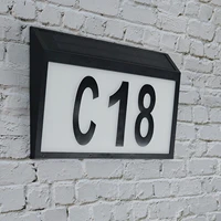 address sign light illuminated doorplate house number mailbox hotel fence