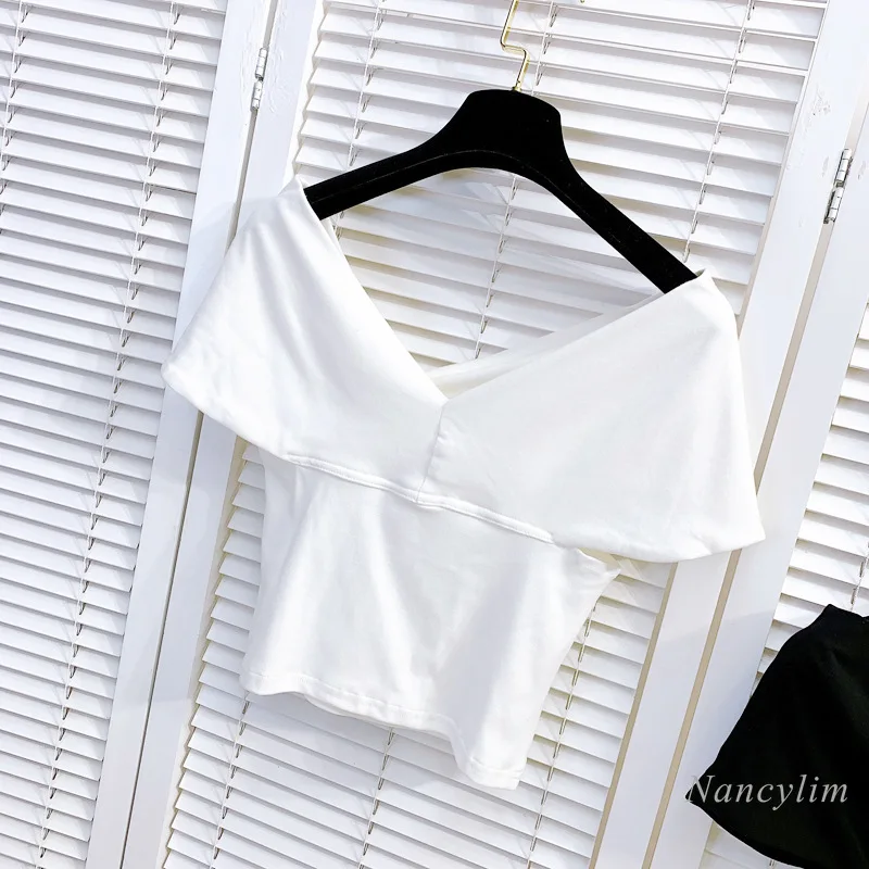 Camiseta de verano para mujer, Top corto de algodón elástico con lazo grande y hombros irregulares, ajustada, manga corta, blanco y negro, 2021