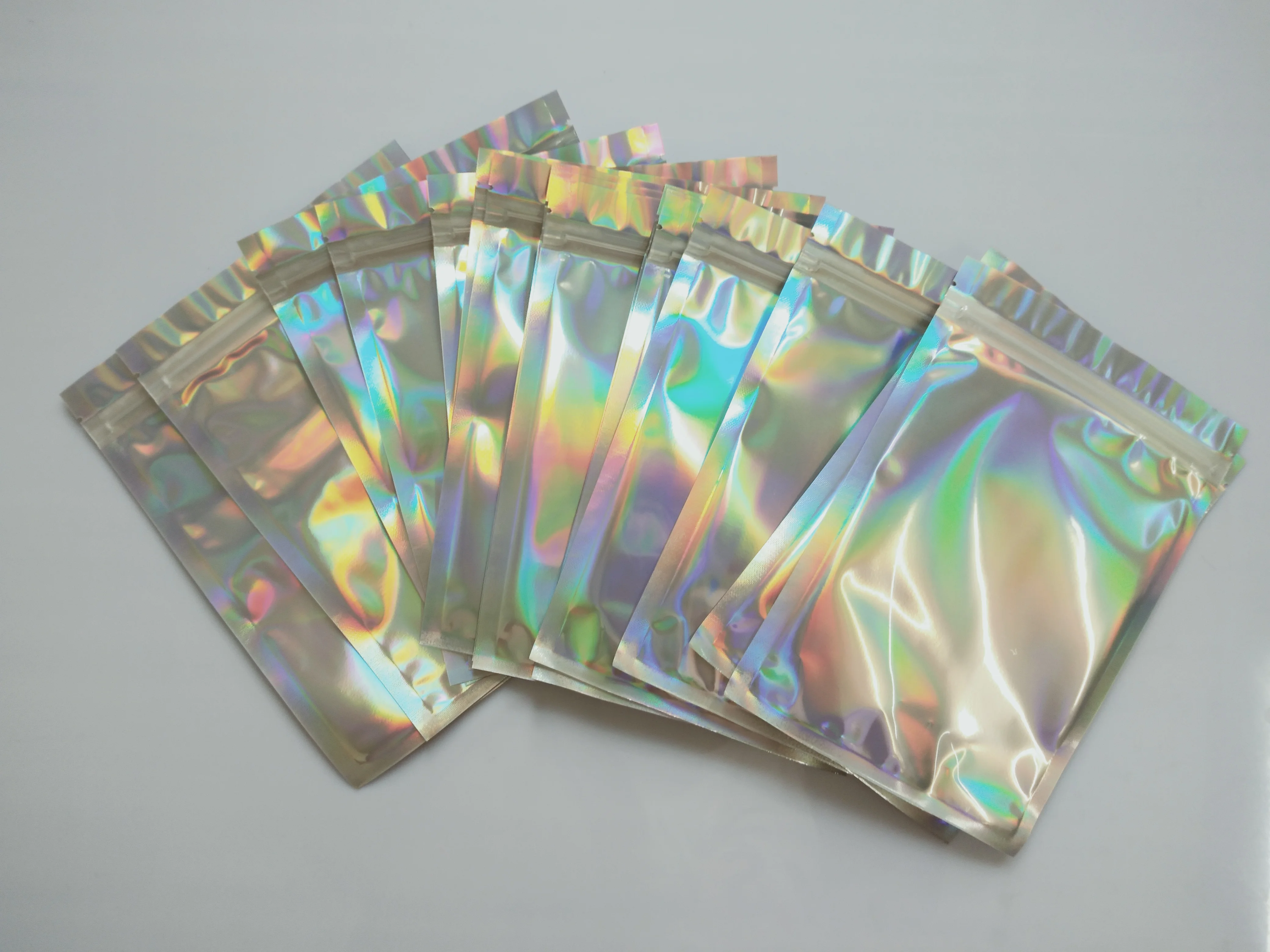 

150pcs Mylar Zipper Bags Aluminum Foil Closure Food Storage Bags Holographic Rainbow Color Mylar Bags Resealable Pouch