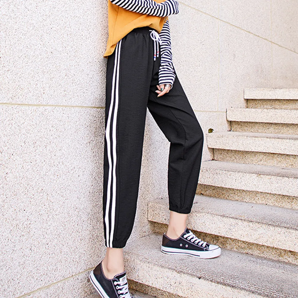 Штаны спортивные женские свободные с полосками по бокам размера плюс | Женская