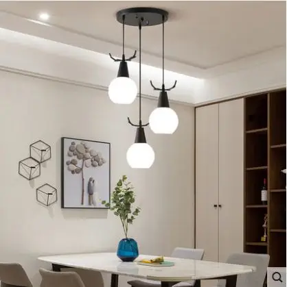 Restaurant Nordic simple modern three-head creative family dining room table antler lamps