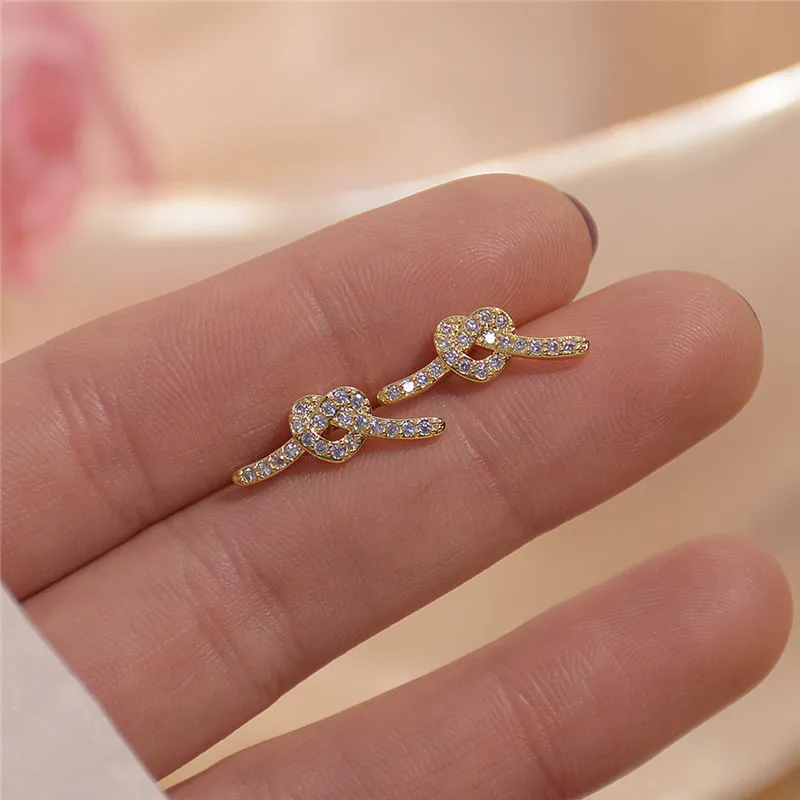 

Ins Hot Sale Luxury 14K Real Gold Love Knotted Shape Stud Earrings for Women Cubic Zircon ZC Earrings