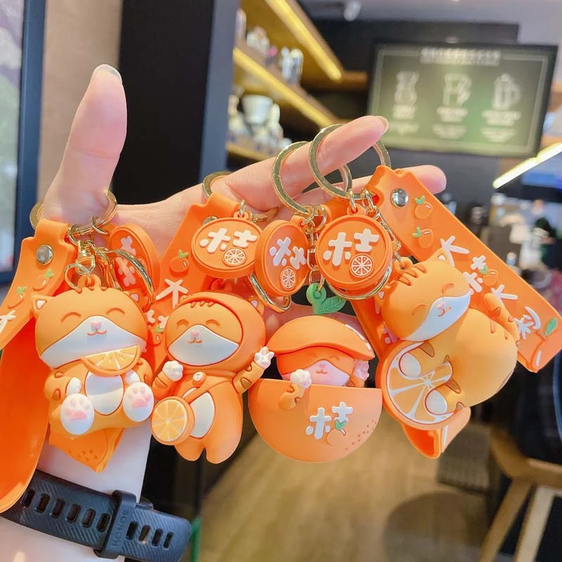

New style fashionable creative cartoon orange cat doll key chain cute bag car ornaments jewelry accessories wholesale