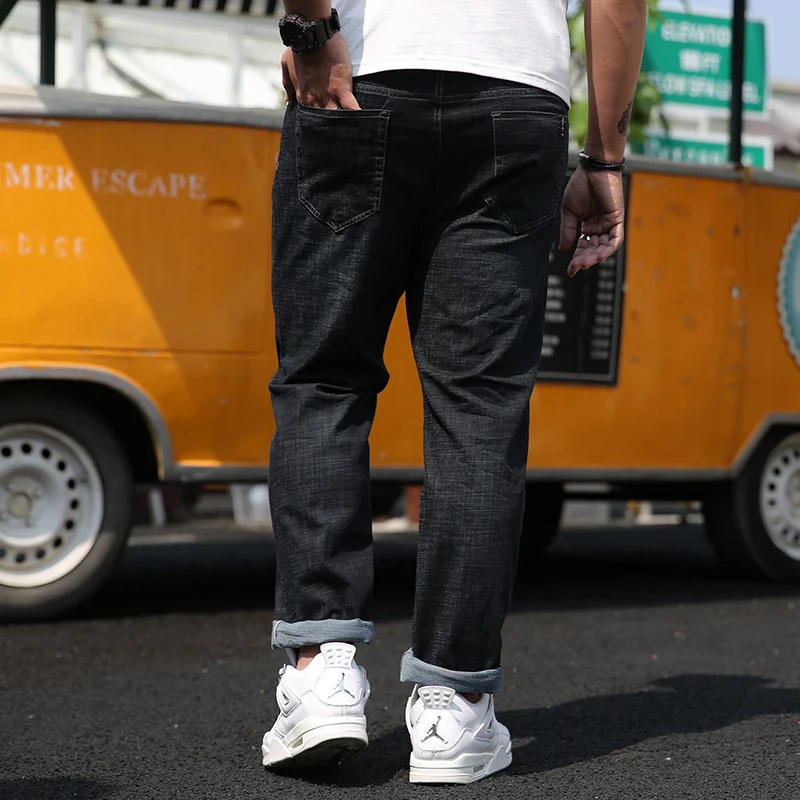 

Plus size men's denim trousers 2020 autumn and winter clothes new Plus Fertilizer Elasticity jeans Casual loose black trousers