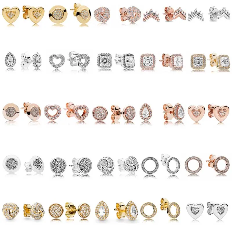 

Серьги-гвоздики женские из серебра 925 пробы двухцветные с куполообразным золотым сердцем