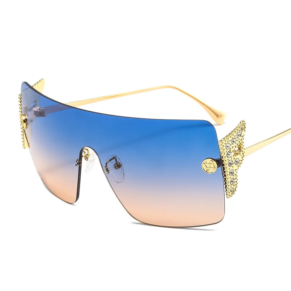 

Free shipping New fashion personality wing inlaid diamond Sunglasses f family frameless one piece women's Sunglasses