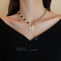korean version of simple fashion black and white pearl hao stone love pendant necklace female temperament wild clavicle chain