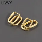 Серьги-гвоздики серебристого цвета с двойным овальным геометрическим рисунком