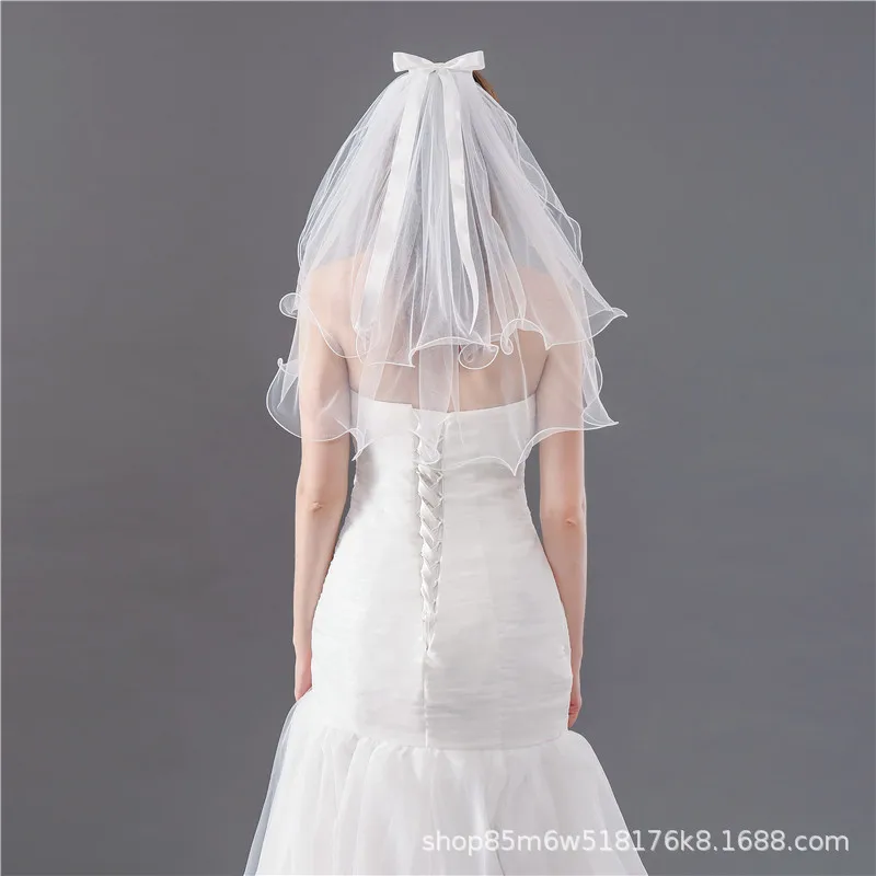 Белый бант двухслойная маленькая вуаль с боковым гребнем для волос фото тиара