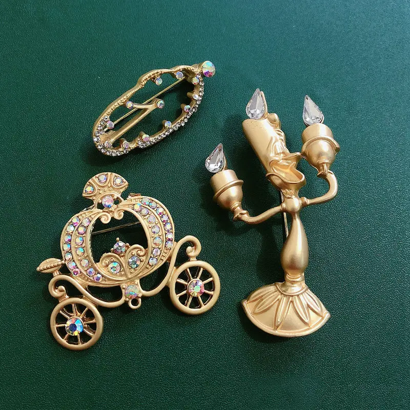 

Muylinda Golden Rhinestones Enamel Cartoon Fairy Tale Brooches Candlestick Pins\Pumpkin Carriage\Deformed Clock Pins for Women