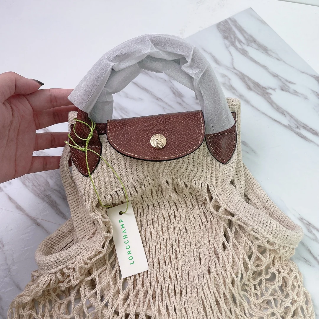 

Longchamp New hollow out woven bag cotton lining straw bag for summer beach female Reticulate handbag netted beach bag