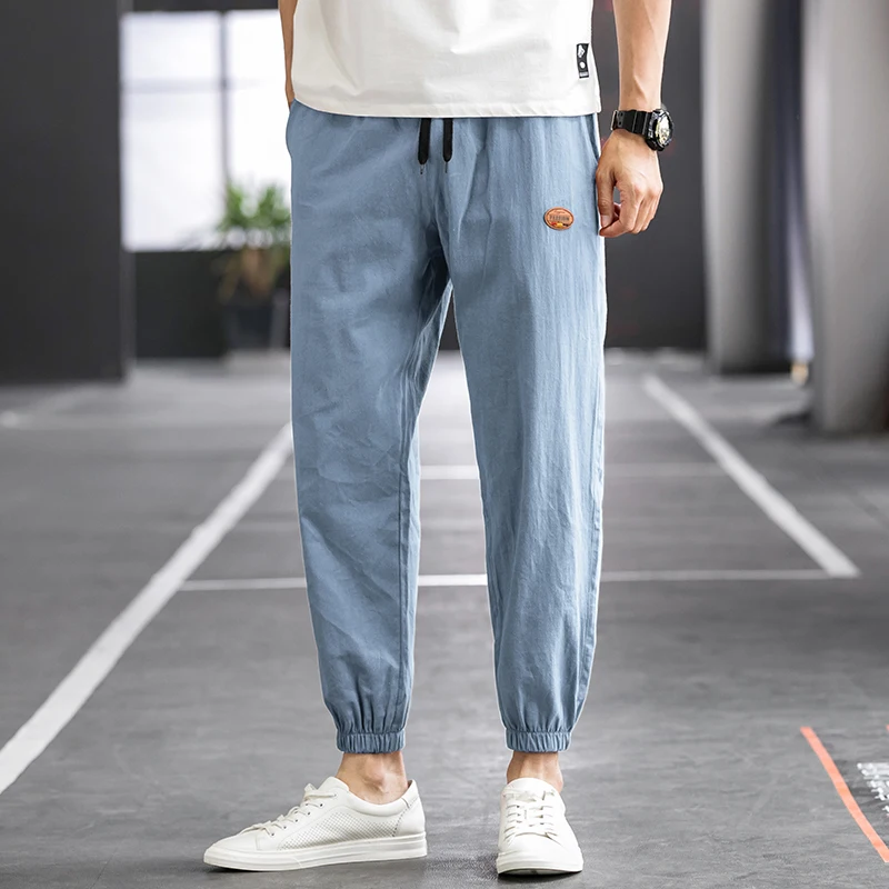 

2021 New Fashion Baggy Black Pants Men's Solid Color Elastic Waist Streetwear Joggers Pants Men's Cotton Harem Casual Pants