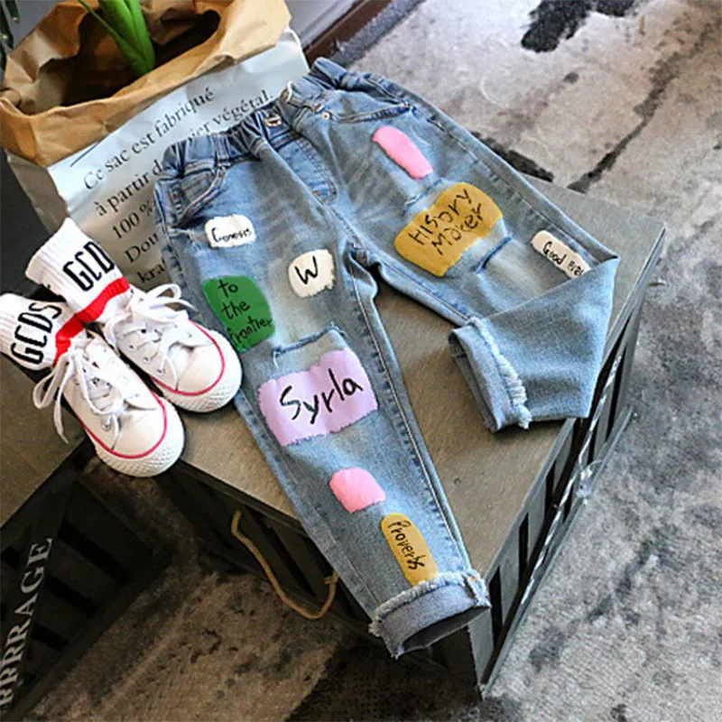 

Clothing for Girls Patchwork Jeans Fall Loose Printed Letters Ripped Jeans Cool Cotton Kids Clothes Elastc Wasit Pants Bottoms