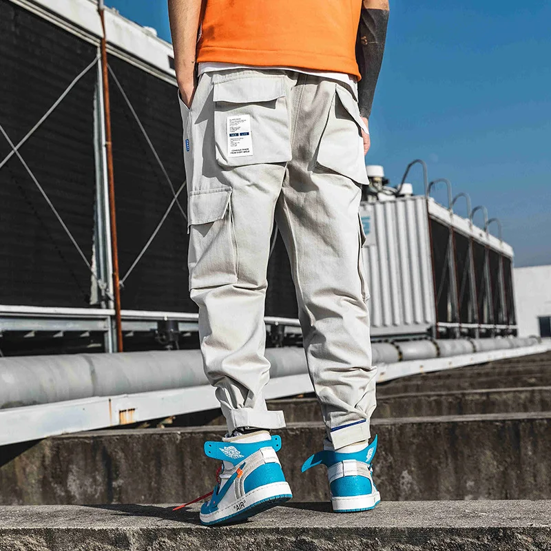 

Брюки мужские с эластичным поясом, уличная одежда, спортивные штаны в Корейском стиле, брюки-карго в стиле хип-хоп, Харадзюку, много карманов...