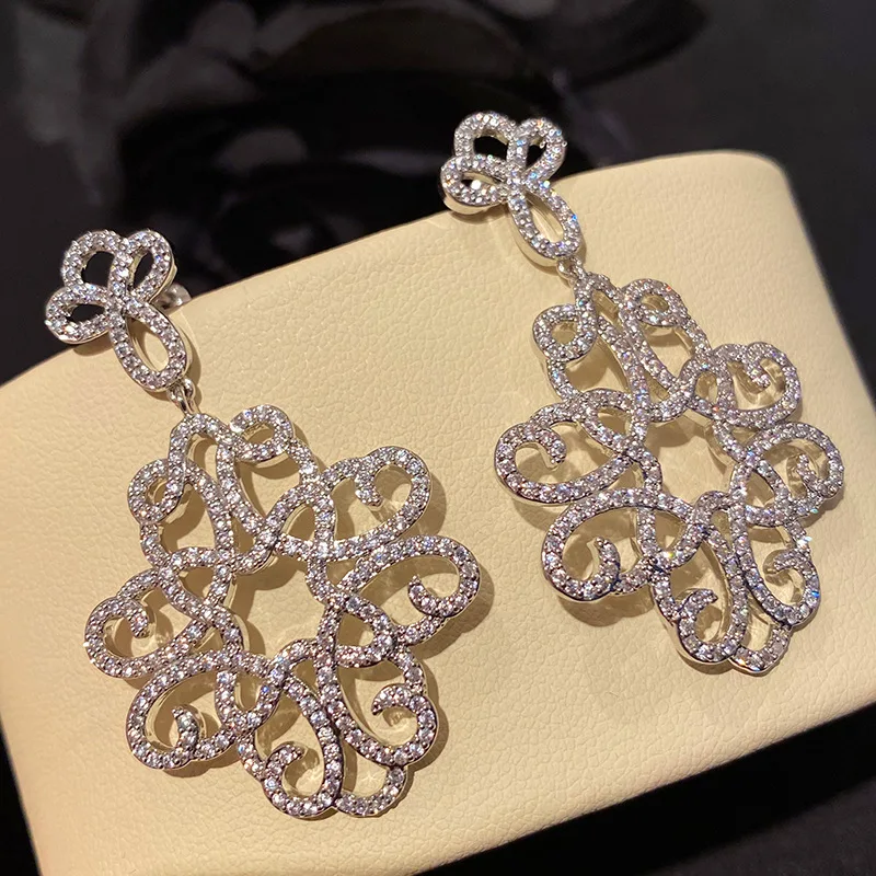 

Arabesque Retro Zircon Wholesale New Korean Personality Earring Hollow Out Flower Pattern For Women Silver Color Jewelry