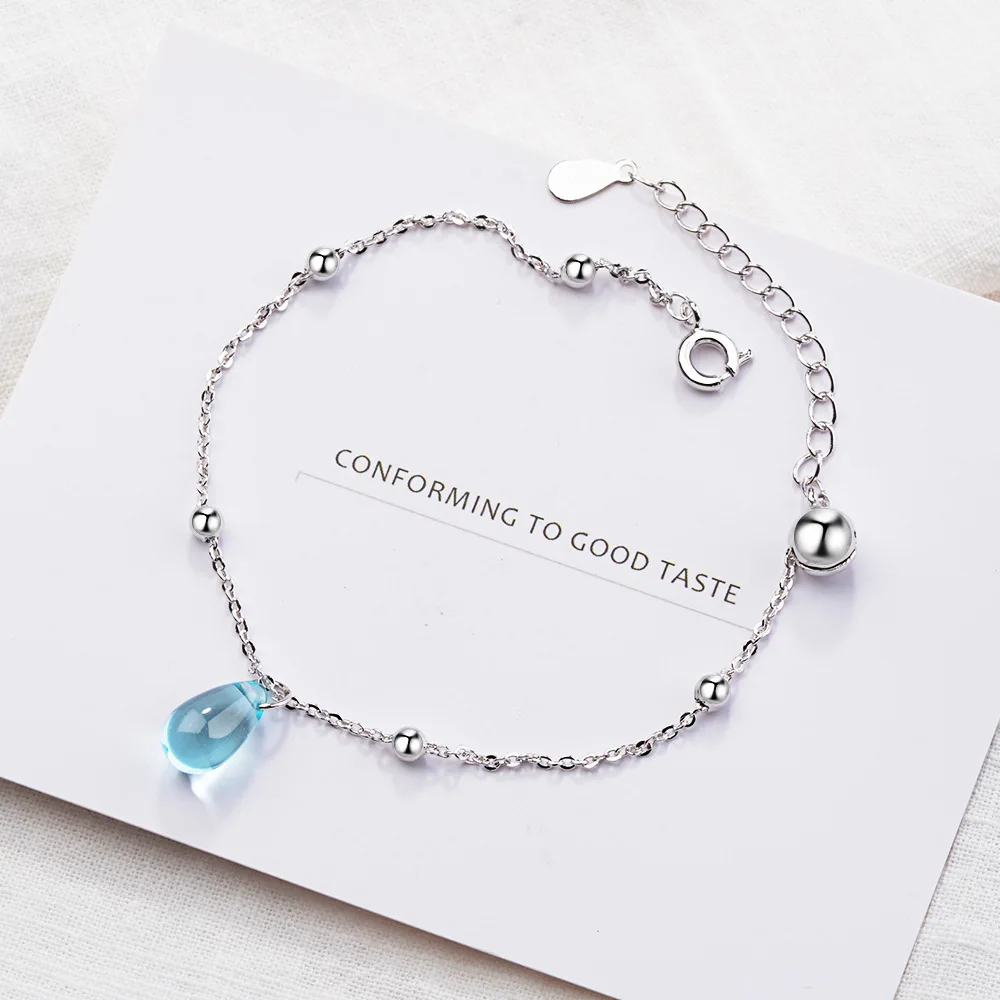 Женский браслет из серебра 925 пробы с голубыми кристаллами в форме капли