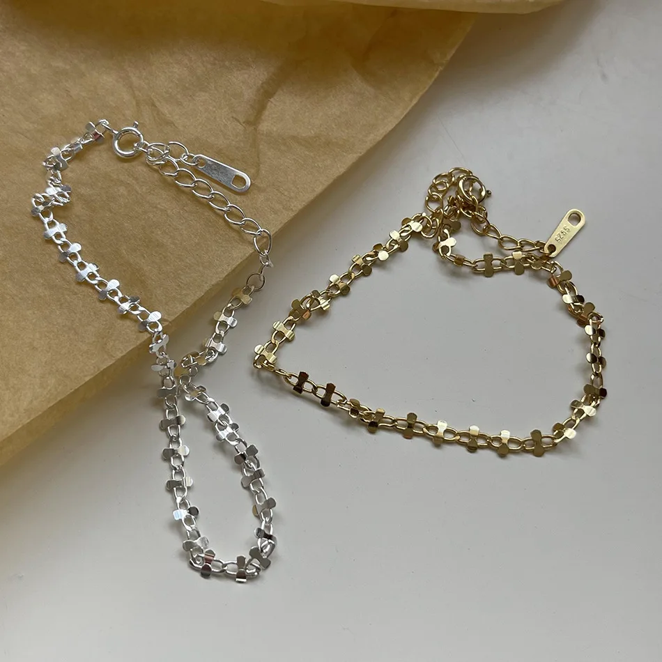 Оригинальный браслет-цепочка из серебра и золота 18 карат