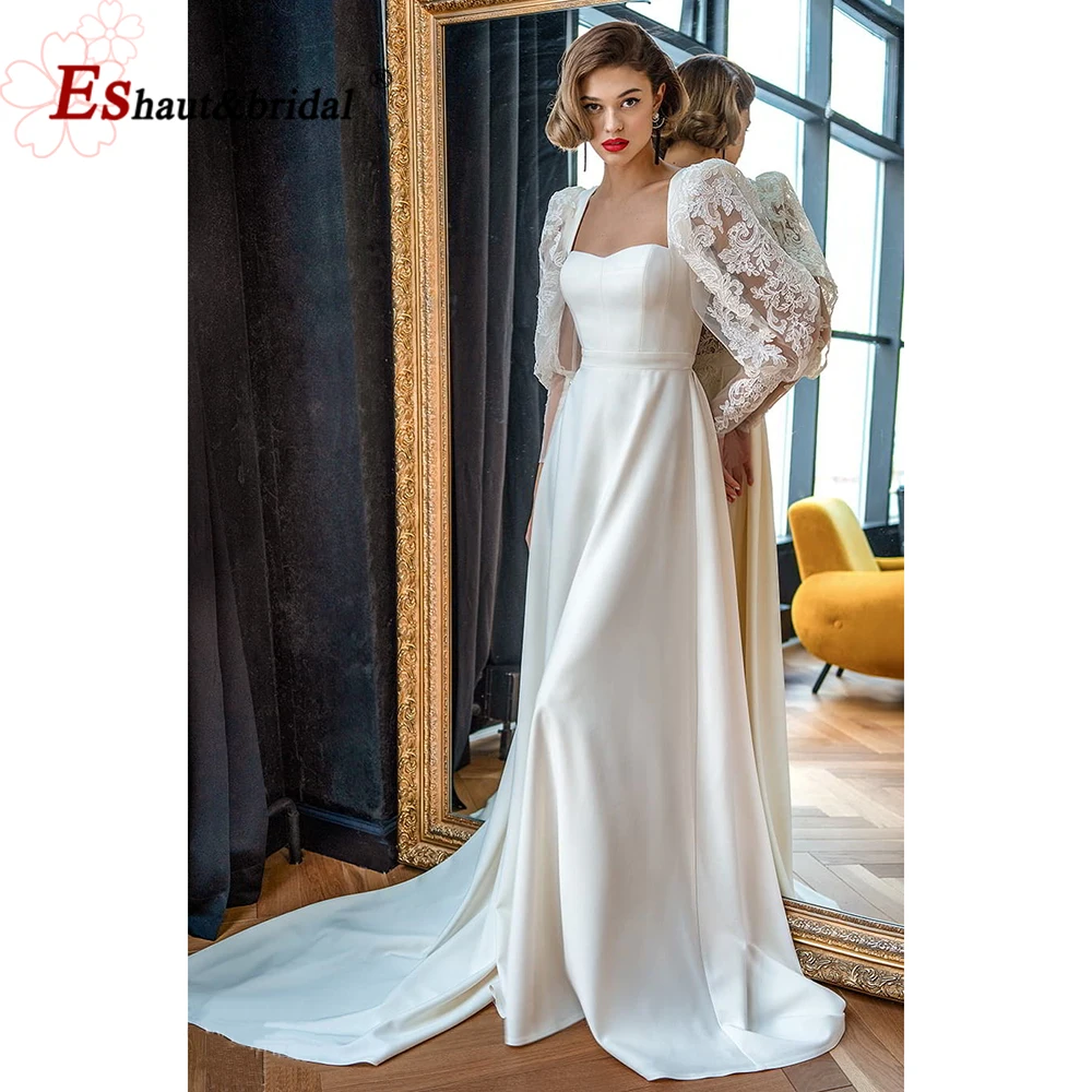 

Женское атласное платье с длинными рукавами-фонариками и открытой спиной