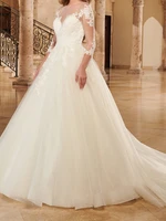 fancy wedding dress sheer neckline with appliuque three quarter sleeves zipper with buttons back bridal gowns