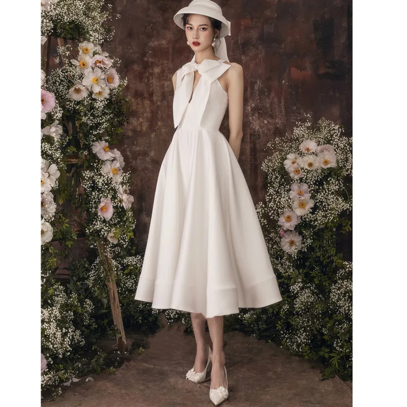 

2021 luxury design fashion Satin banquet dress temperament Long Sleeve White Bow Dress Sexy elegant slim French wedding dress