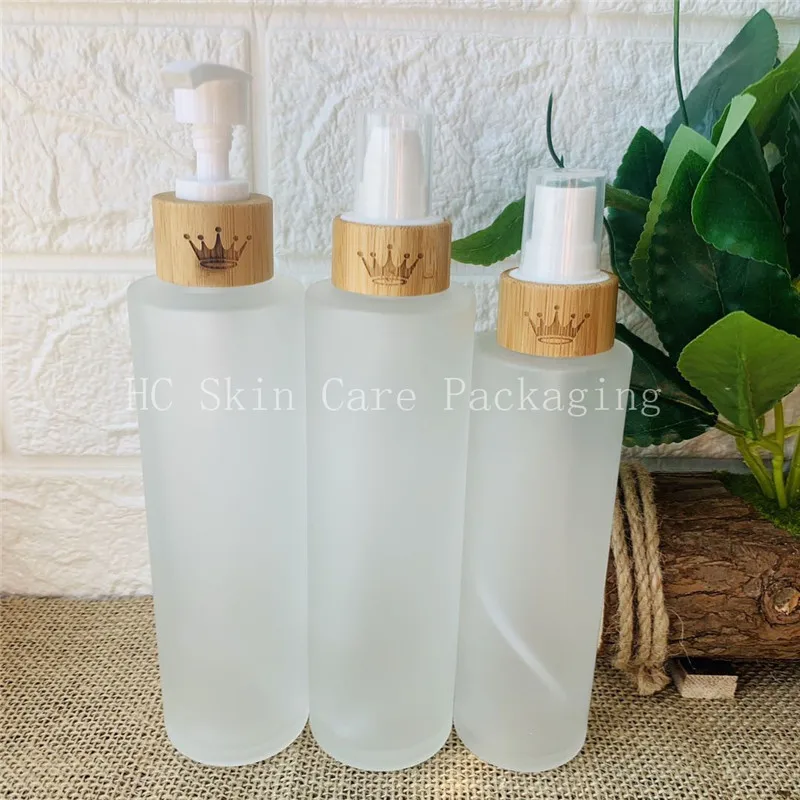 

Childproof cap 30ml 50ml 100ml clear frosted flat shoulder essential oil cosmetics bamboo glass lotion bottle