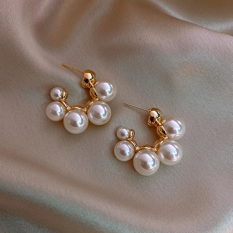 

Fashion personality niche design curved pearl earrings new net celebrity temperament elegant trendy explosion earrings for women