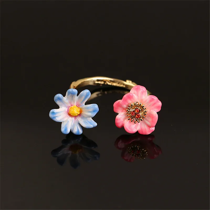 

Korean version of the net red temperament two-color flower open ring enamel color glaze large size ins forest ring female trend