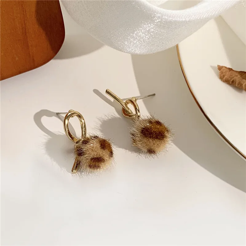

South Korea 2020 the new asymmetric metal knot leopard lint earrings stud earrings female personality