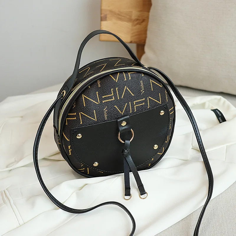 

2021 forever young Korean style women's mobile phone small round bag creative rivet trendy fashion Joker shoulder crossbody bag