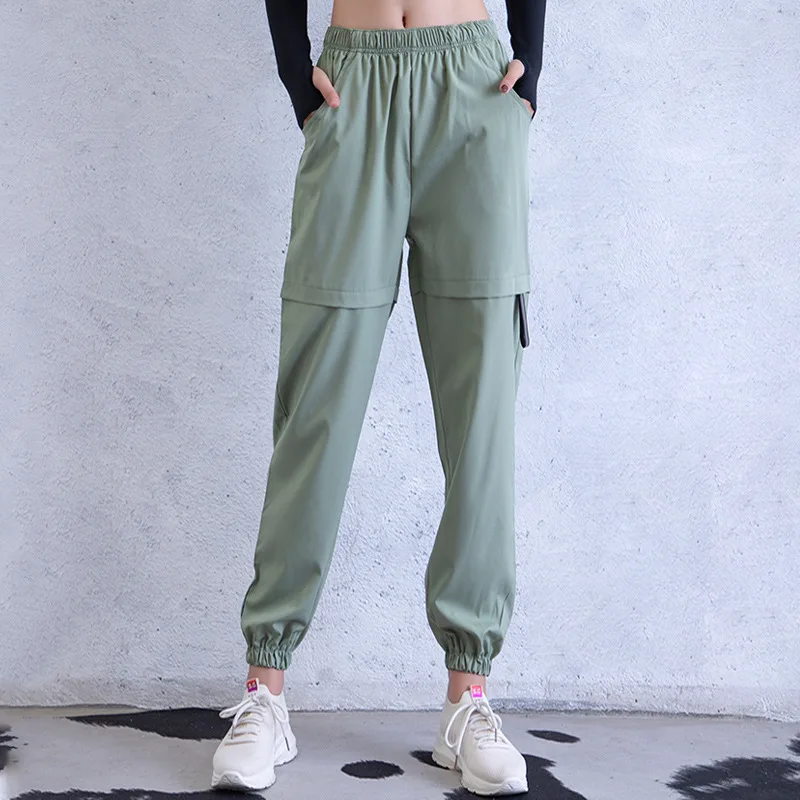 

2021 New Arrival Women Sports Pants with Pockets Stretchy Running Cycling Fitness Leggings Solid Color Loose Harem Pants