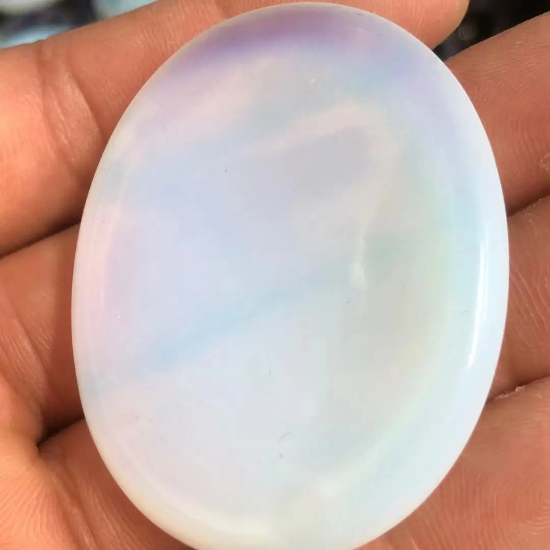 

Natural opal produced for thumb clasp.Crystalline energy points are used for reiki healing