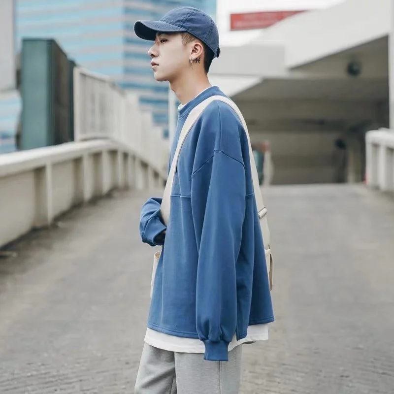 

Autumn and winter Korean version of the pure color tide men's sweater fake two pieces of youth sports ulzzang jacket lovers