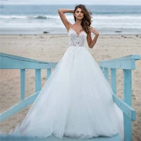 sheer scoop neck tulle beach wedding dresses lace appliques beaded pearls soft sleeveless buttons back bridal gowns formal long