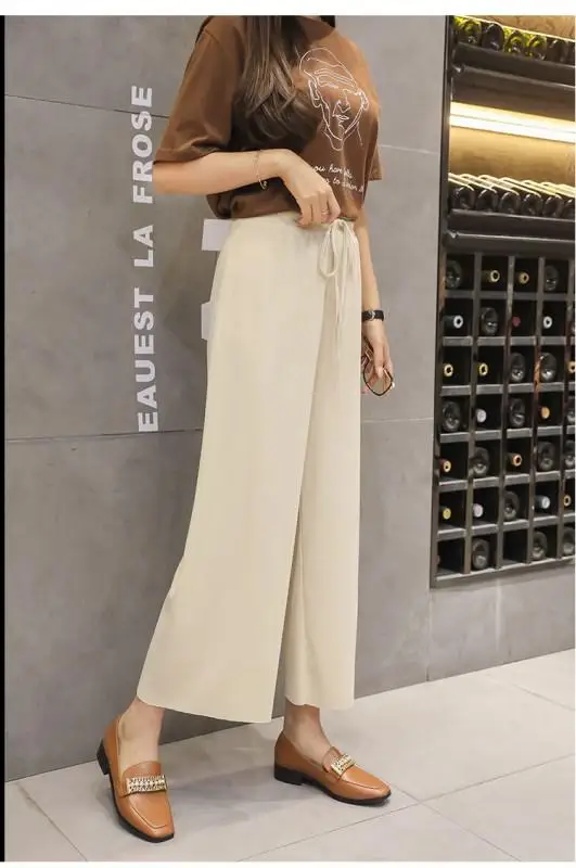 Женские летние тонкие трикотажные брюки черные широкие свободные до щиколотки