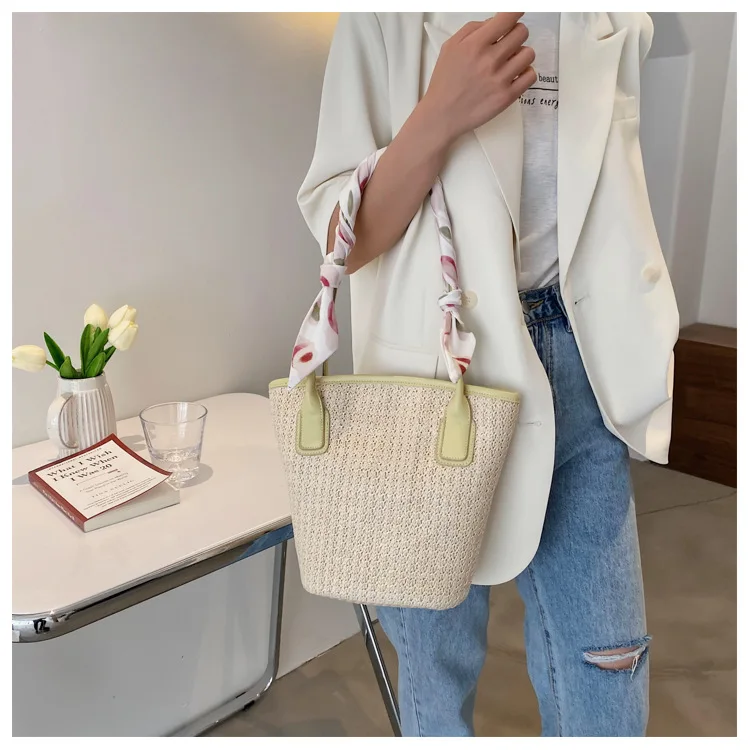 

Summer woven hand-held beach bag for women 2021 new tidewater bucket one-shoulder straw woven bag with simple slung bag