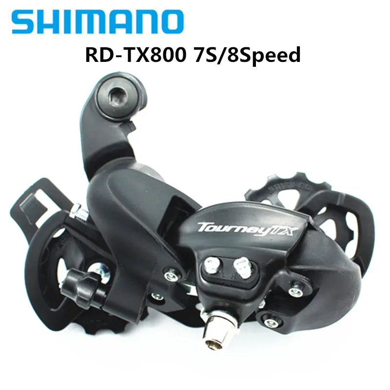 Задний переключатель для горного велосипеда SHIMANO RD-TX800 совместимый с 7/6 скоростями и маховиком 11/14T абсолютно новый оригинал.