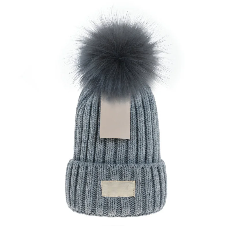

Wholesale Winter caps Hats Women bonnet Thicken Beanies with Real Raccoon Fur Pompoms Warm Girl Cap snapback pompon beanie Hat