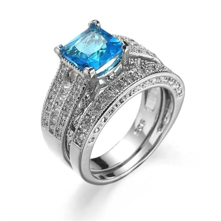 

ANGLANG 2PC Women Silver Colour Finger Rings Wedding Engagement Jewelry Dazzling Blue Cubic Zircon Gorgeous Female Classic Set