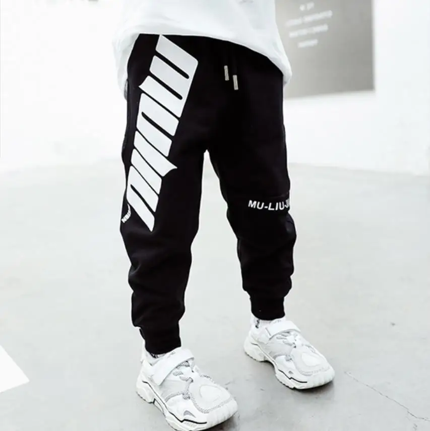

Children's sports pants 2020 spring new spring & autumn children's trousers loose tide brand casual letter beam foot pants 2-8y