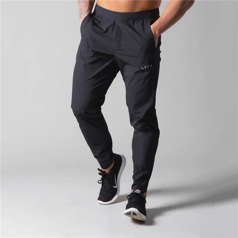 

2021 LYFT Quick Drying Joggers Sweatpants Men Slim Casual Pants Male Gym Fitness Workout Trackpants Sport Track Pants