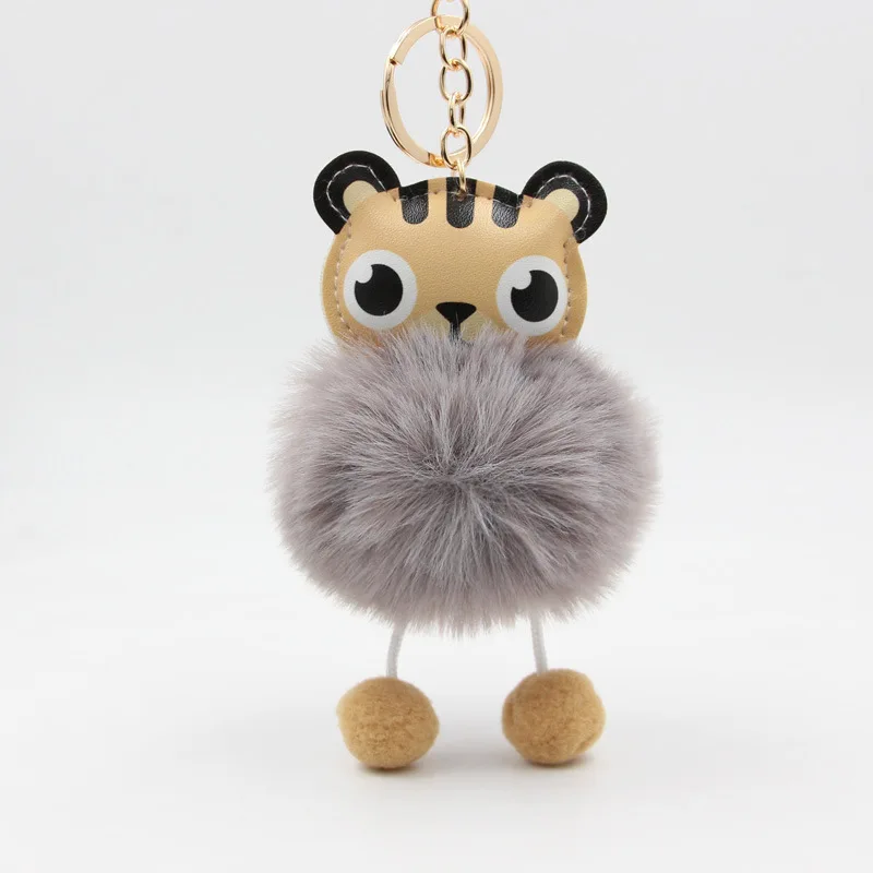 

Мультяшный брелок с помпоном из искусственного пушистого тигра, брелки для автомобиля, подвески, брелок для автомобиля, женский кулон для с...