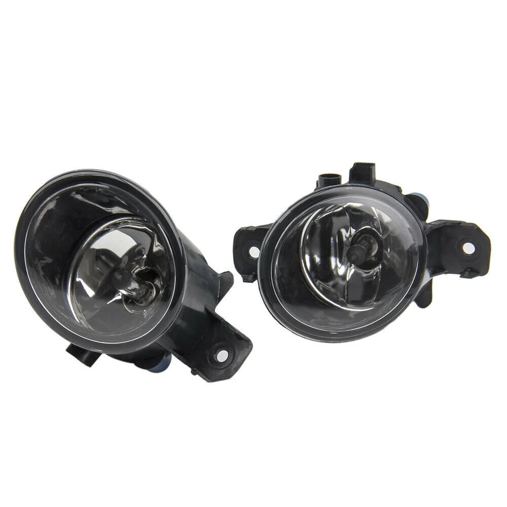 

A pair of fog lamps with mounting screws