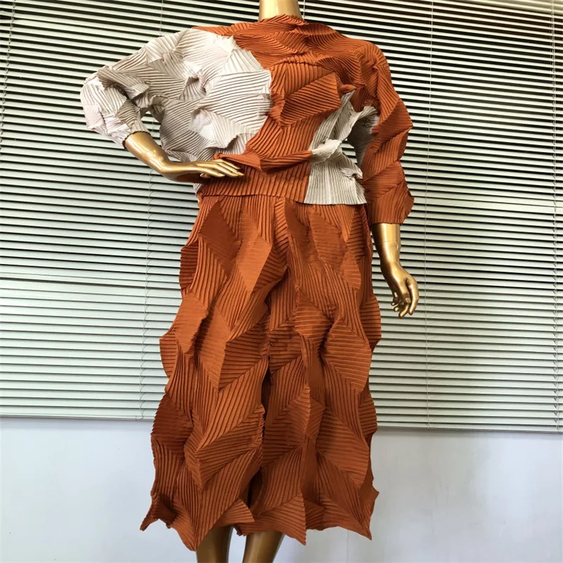 

Miyake pleated suit European standing body pleated bat sleeve Tshirt + wide leg pants fashion temperament hand pleated two-piece