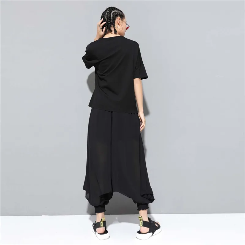 

Johnature 2021 New Casual Solid Color Women T-shirts Summer Simple All Match Loose O-neck Short Sleeve Irregular Tie Tops