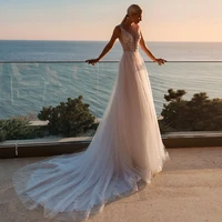 sparkly sheer v neck wedding dresses 2021 a line appliques sequined tulle sweep train illusion button back long bridal gown