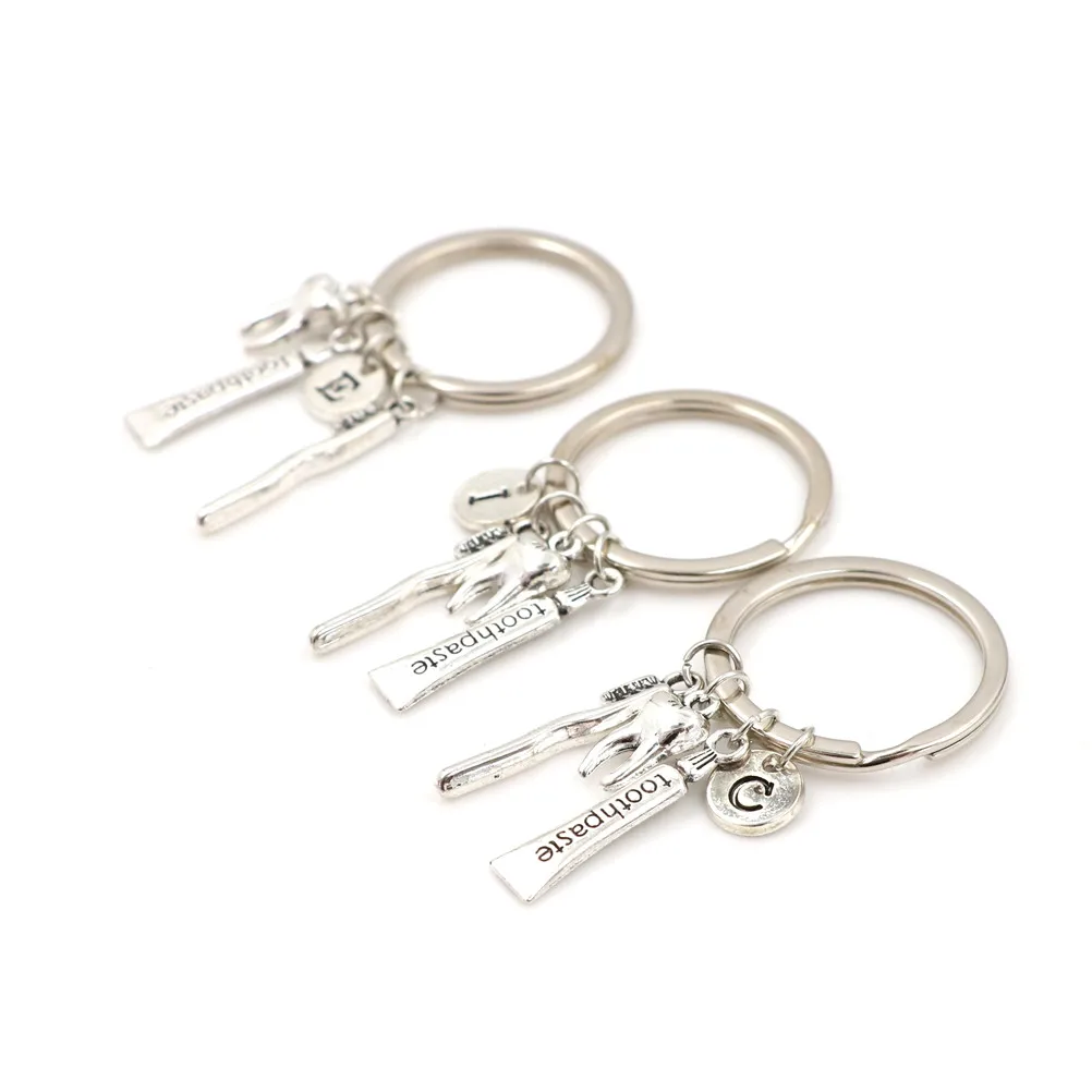 

2pcs Toothbrush Floss Toothpaste Tooth Key Holder Dental Hygienist Keychains Decorative Backpack Pendant Keyring
