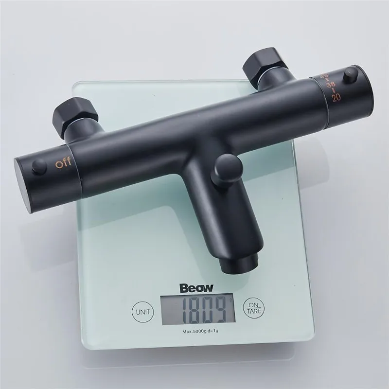 Термостатический смеситель для душа с черным рисунком термостатический ванной