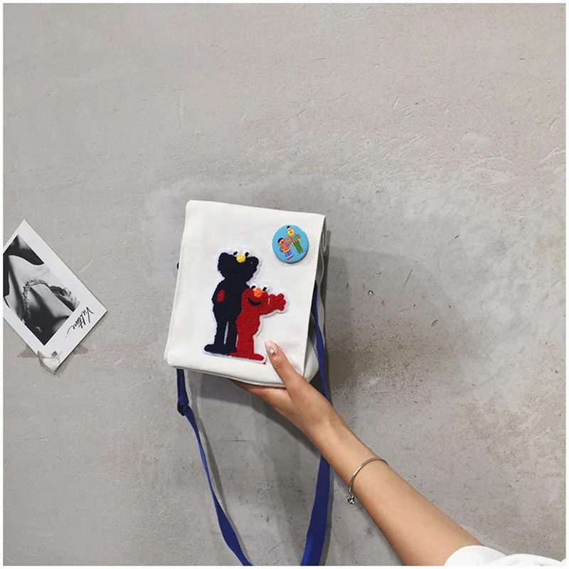 

2019 The new canvas Sesame Street Backpack Shoulder Bag toy doll doll A birthday present for your child