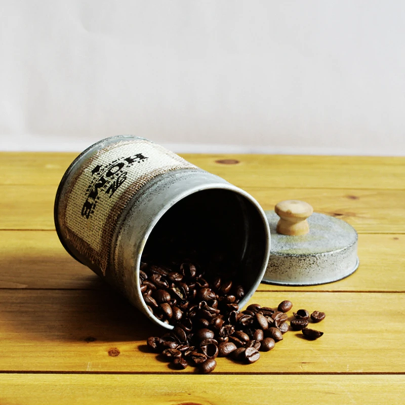 Зерна банки сохранение кованого железа с закрытыми фотографические реквизиты