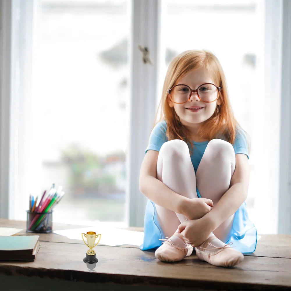 

12pcs Mini Gold Cups Trophy and Award Medals Prizes Small Medals Gift Awards Trophy Toys for Students Sport(6pcs Trophie